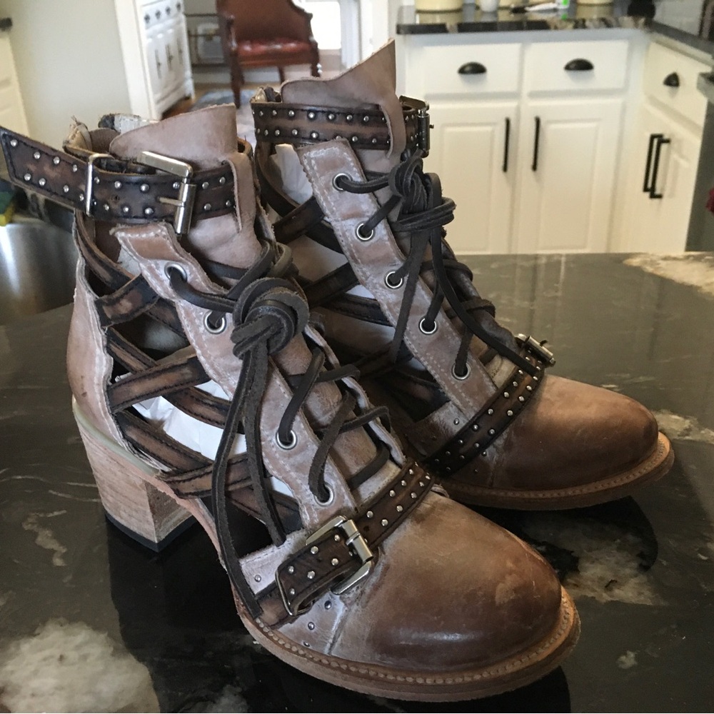 Leather lace up ankle boots with side cut outs. Worn twice.